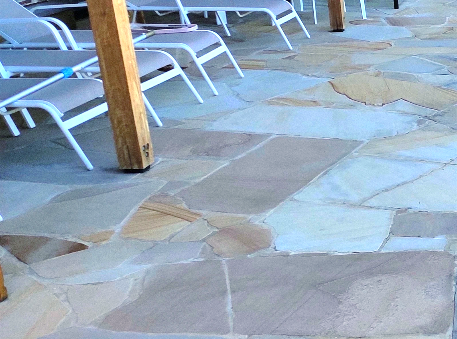 An outdoor area with natural stone tiles.