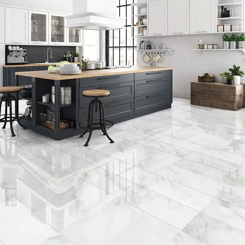 A kitchen with white tile floors and black cabinets.