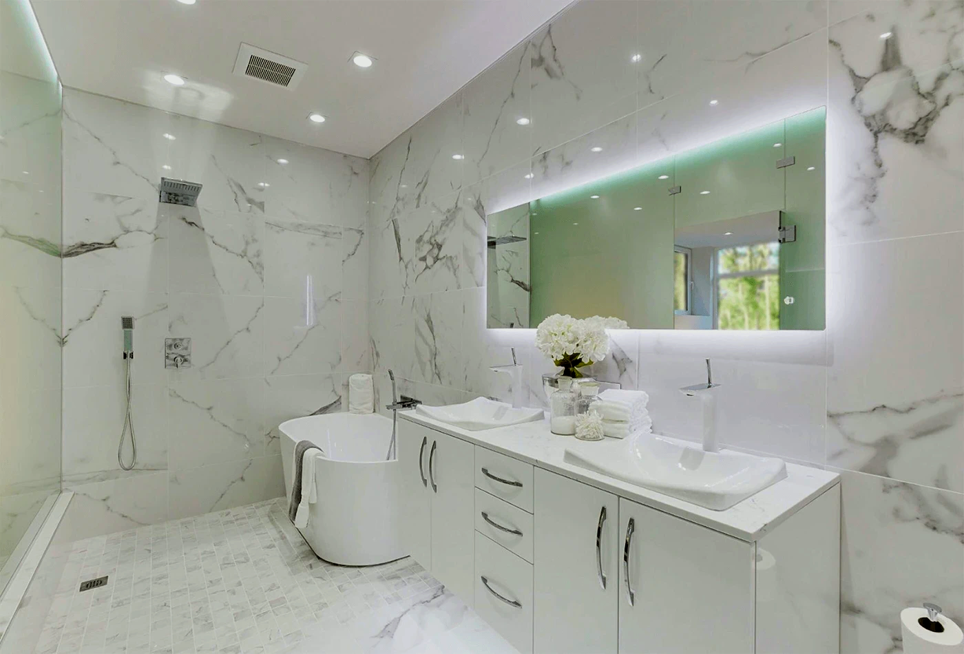 A bathroom with a tub, sink, mirror and shower.