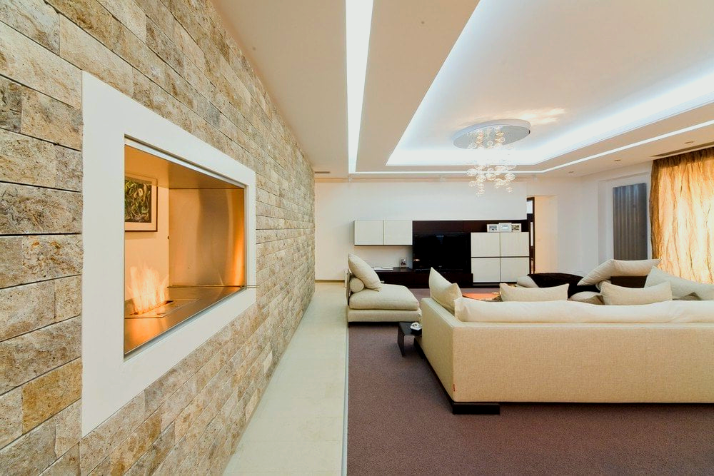 A living room with a fireplace and a couch.