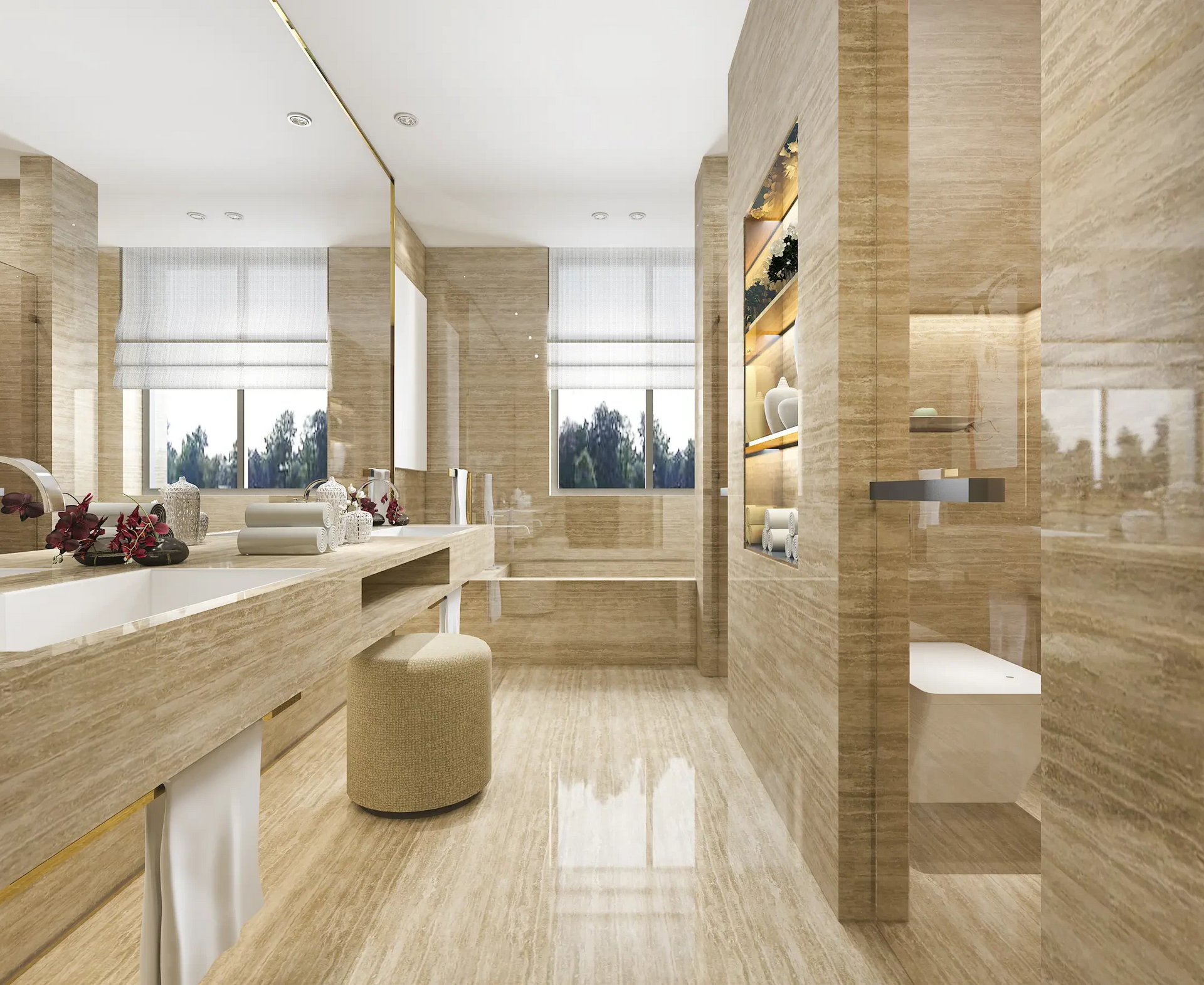 A luxury bathroom with a tub, sink, toilet and mirror.