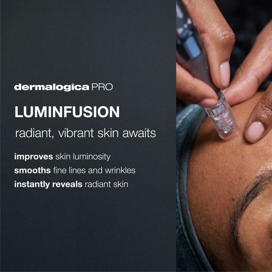 A person getting their nails painted purple at a salon. Bottles of nail polish and a towel are present.