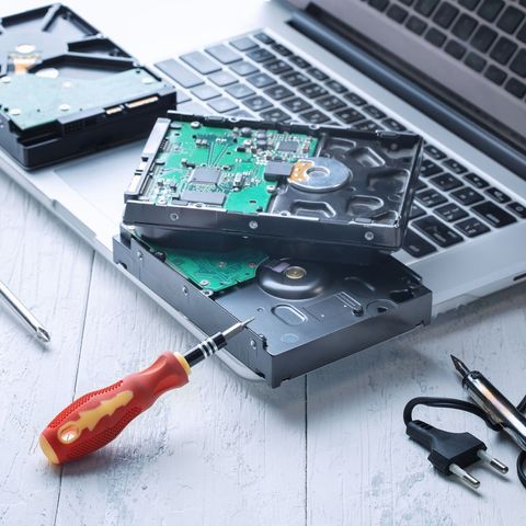 Laptop with Hard Drives and Screw Driver — Virginia Beach, VA — Phone Repair Guy VA Beach