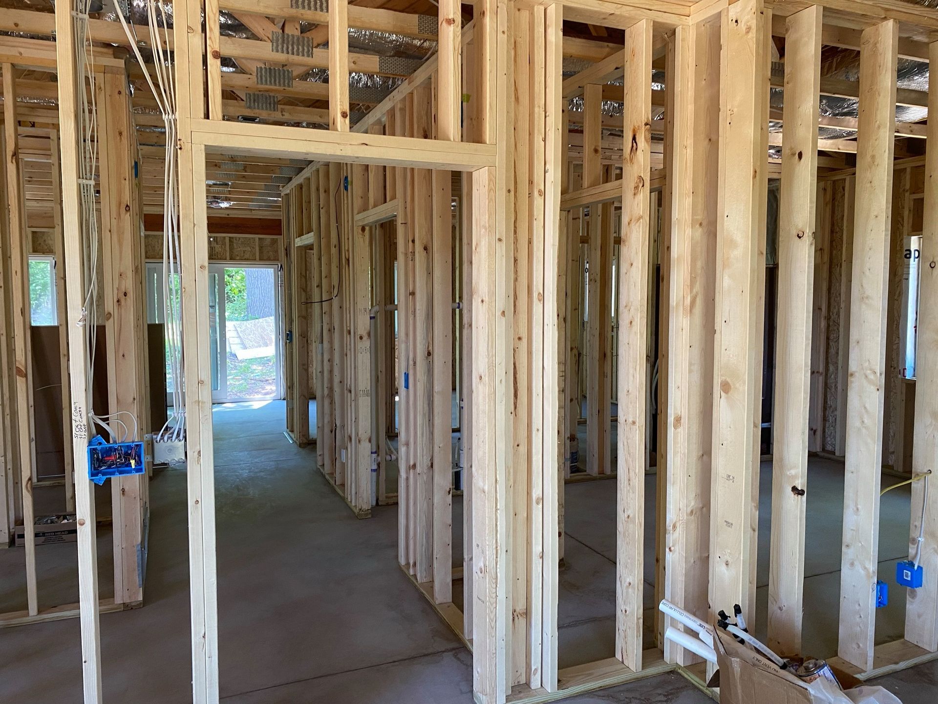 The inside of a house under construction with wooden beams.