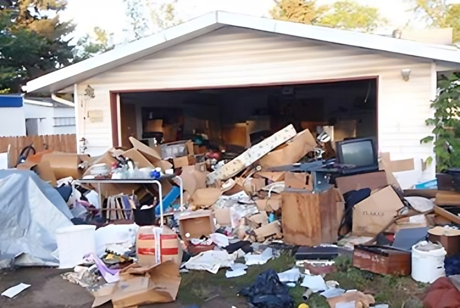 A house with a lot of garbage in front of it