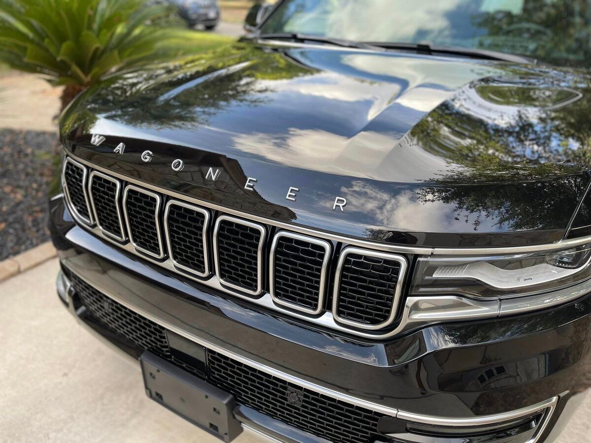 Glossy black Wagoneer car front view