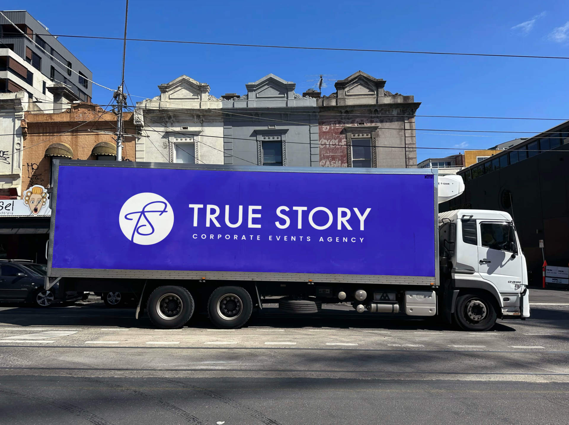 A crowd of people are standing in front of a stage at a concert.