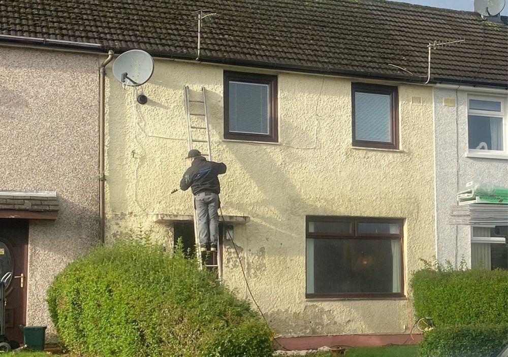 Liberty Painters and Decorators prepping the walls prior to painting of the outside walls of a house in Belmont Ayrshire