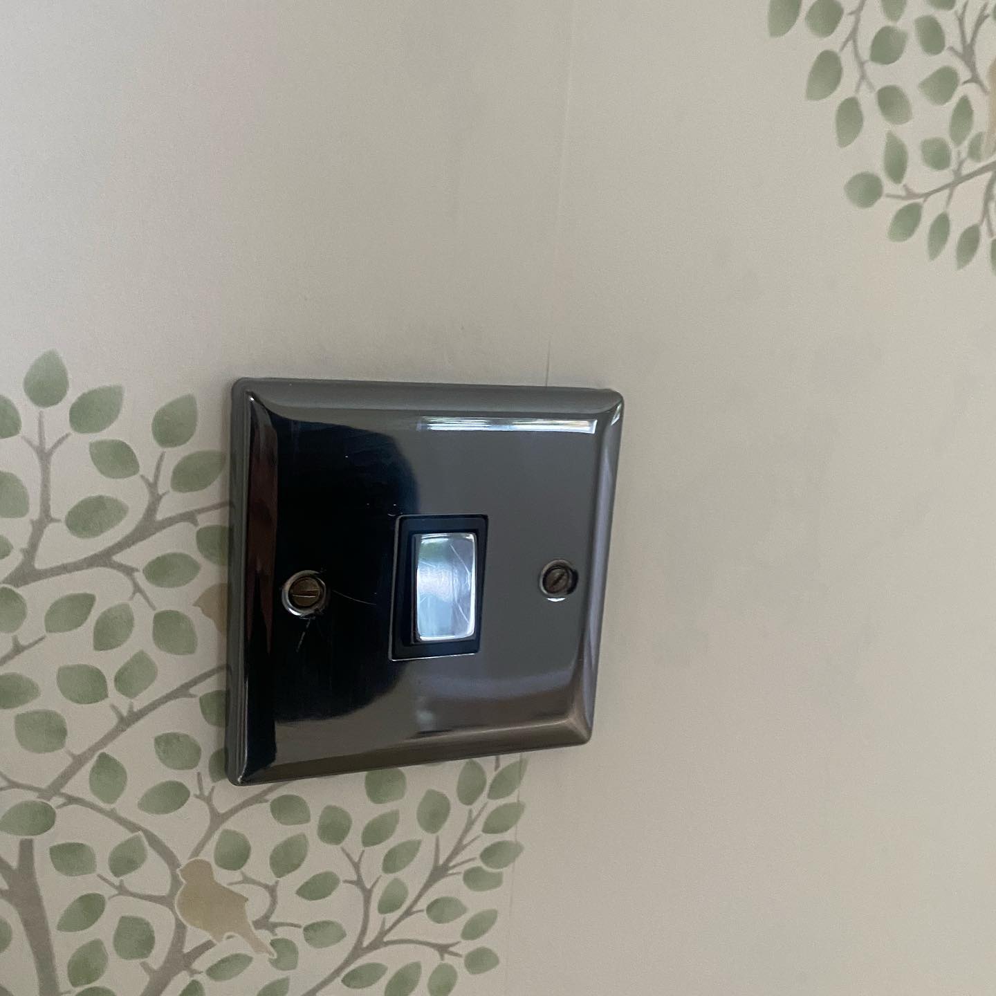 Liberty Painters and Decorators wallpaper fitted neatly around a light switch