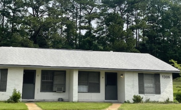 A white house with the number 1326 on the front