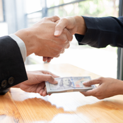 Family smiles inside a car, driving on a sunny day.