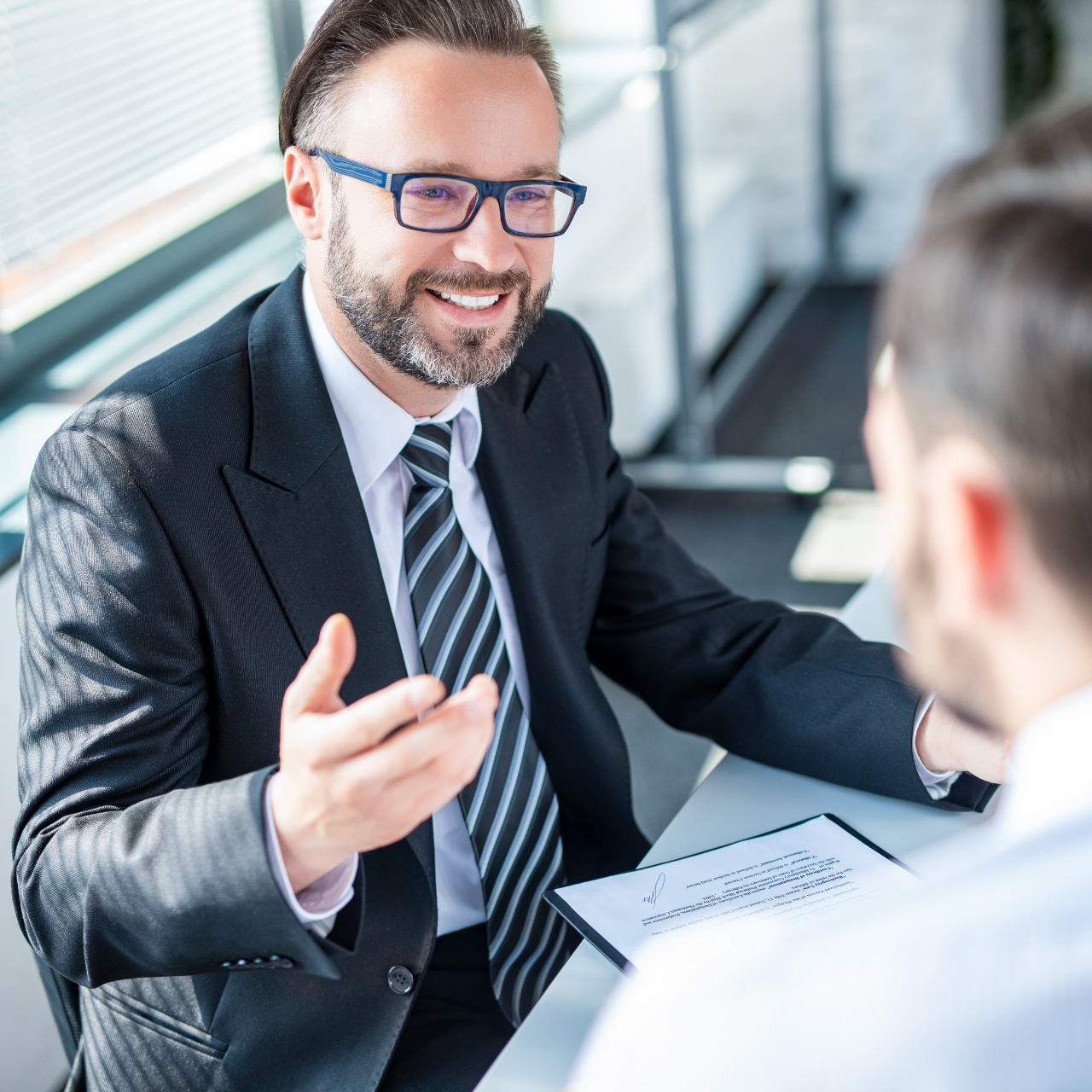 Family smiles inside a car, driving on a sunny day.