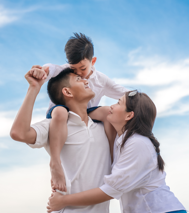 A woman is sitting at a desk with a computer and a sign that says ksw