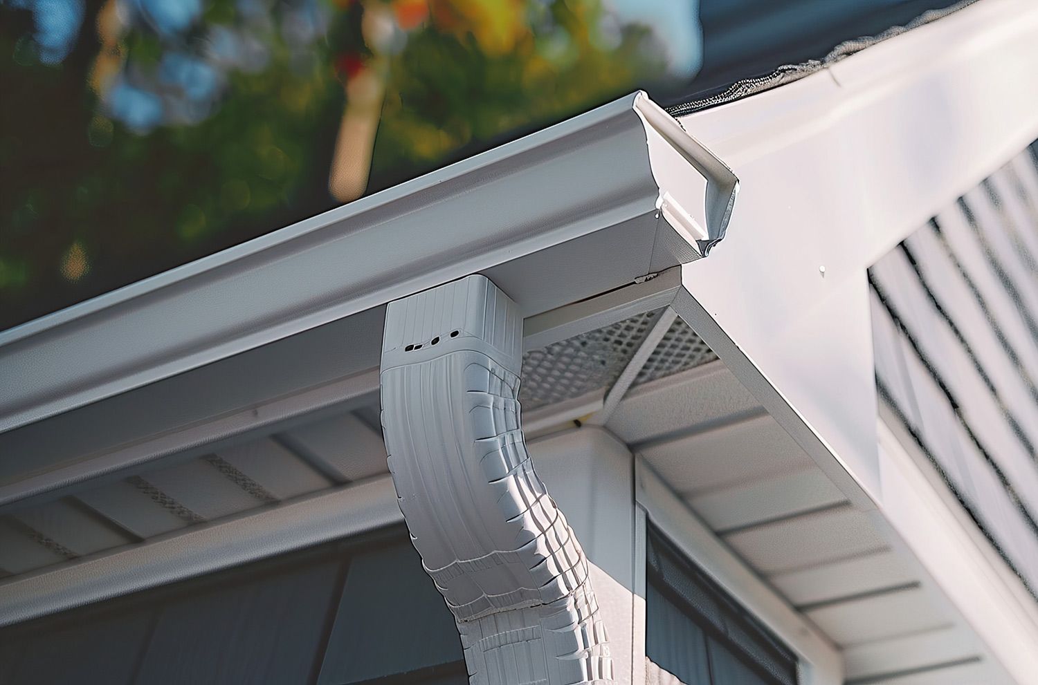 White rain gutter and downspout