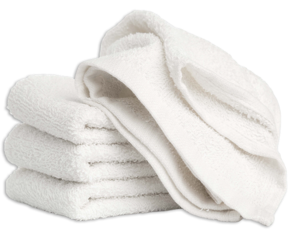 Three white towels are stacked on top of each other