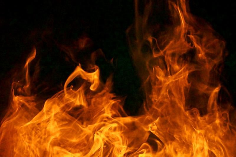 Bright flames rising against a dark background.