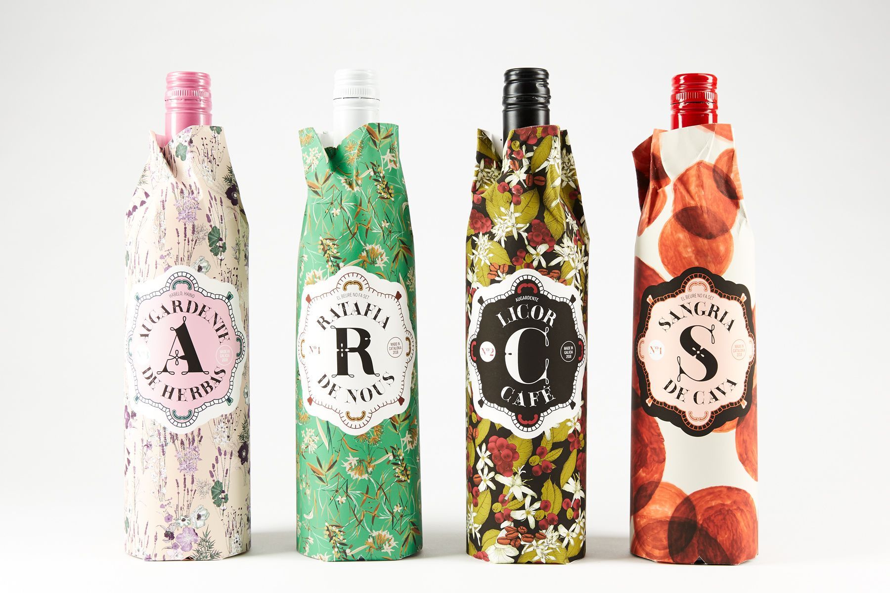 Four patterned bottles with letters A, R, C, and S on a white background.