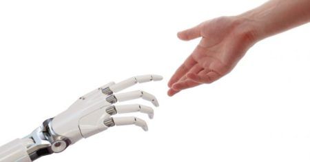 Robot hand reaches out to human hand