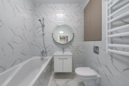 Residential bathroom with a shower attached to the bathtub in Wollongong NSW.