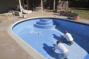pool service contractors performing a repair