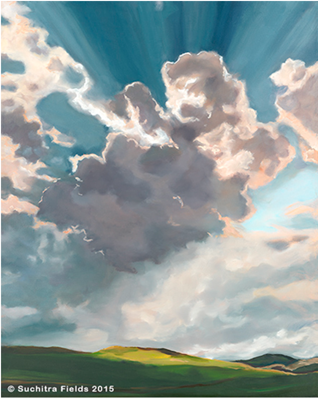 Dramatic cloudscape over a green hillside; sunlight streams through the clouds.