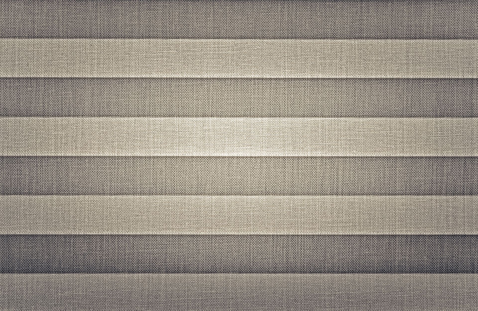 Close-up of beige and gray striped woven fabric texture
