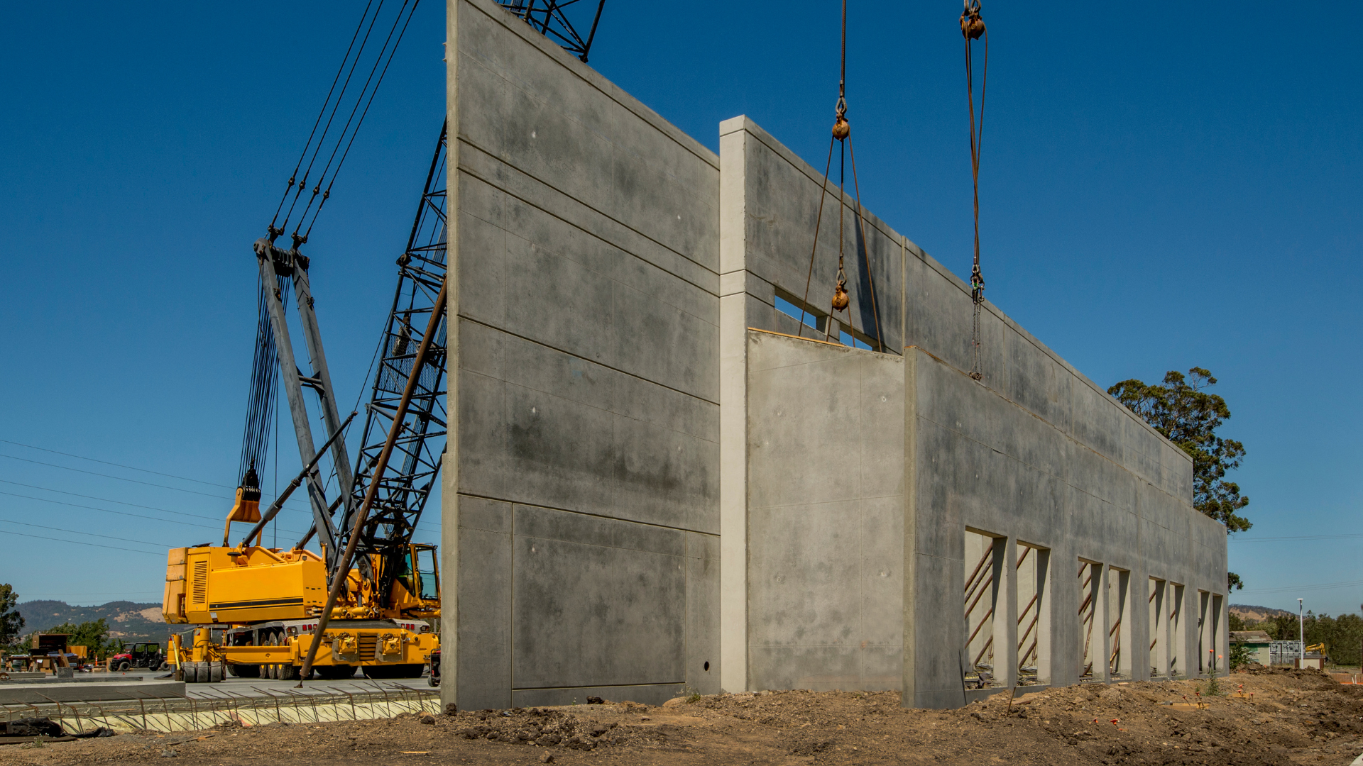 a concrete wall being tilted up into position