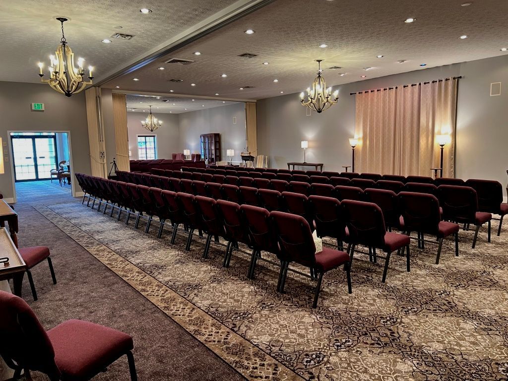 A vase filled with pink flowers is sitting on a table.