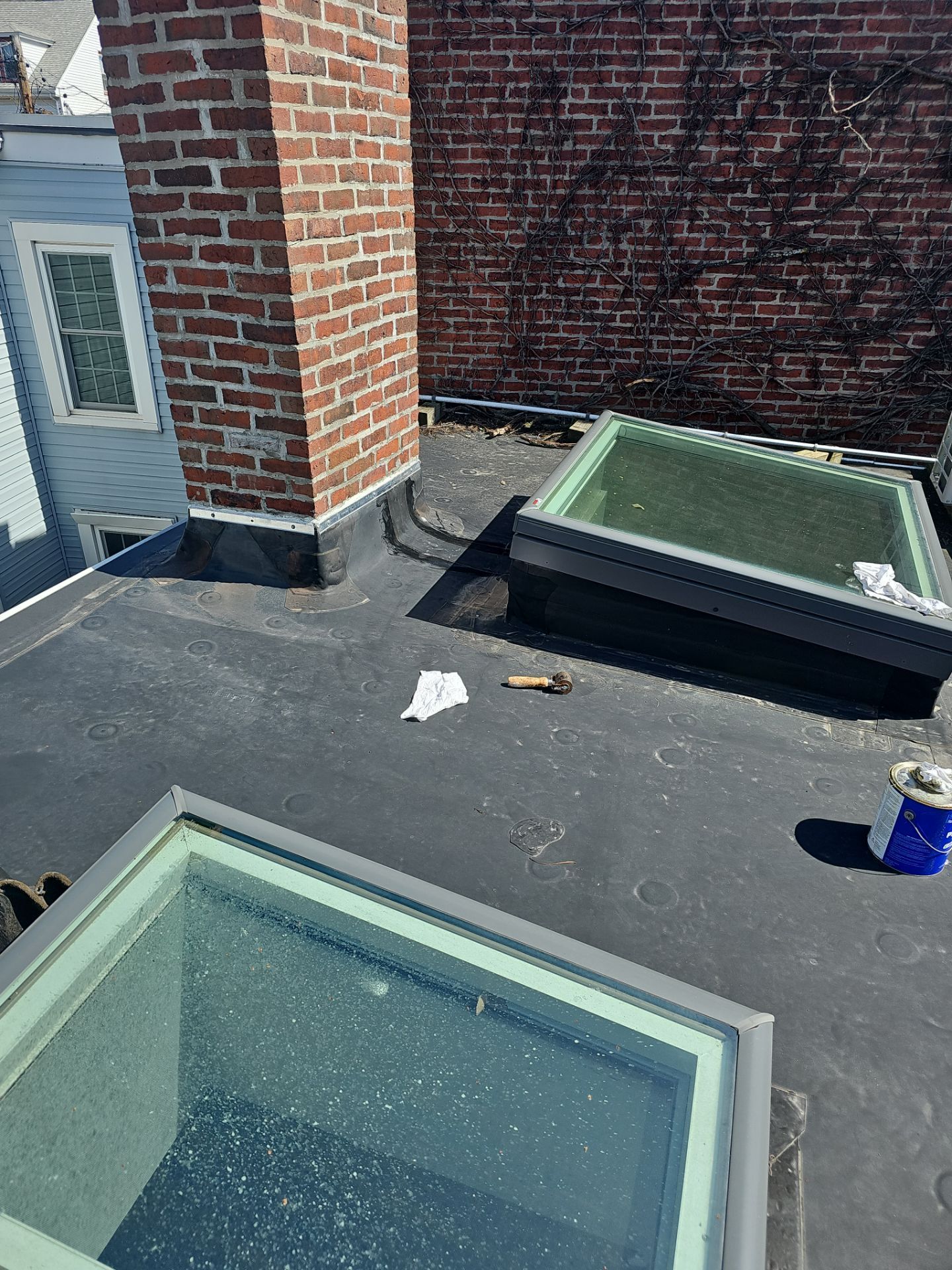 There are two skylights on the roof of a building.