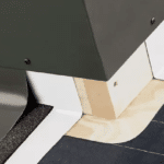 A close up of a piece of metal sitting on top of a tiled floor.