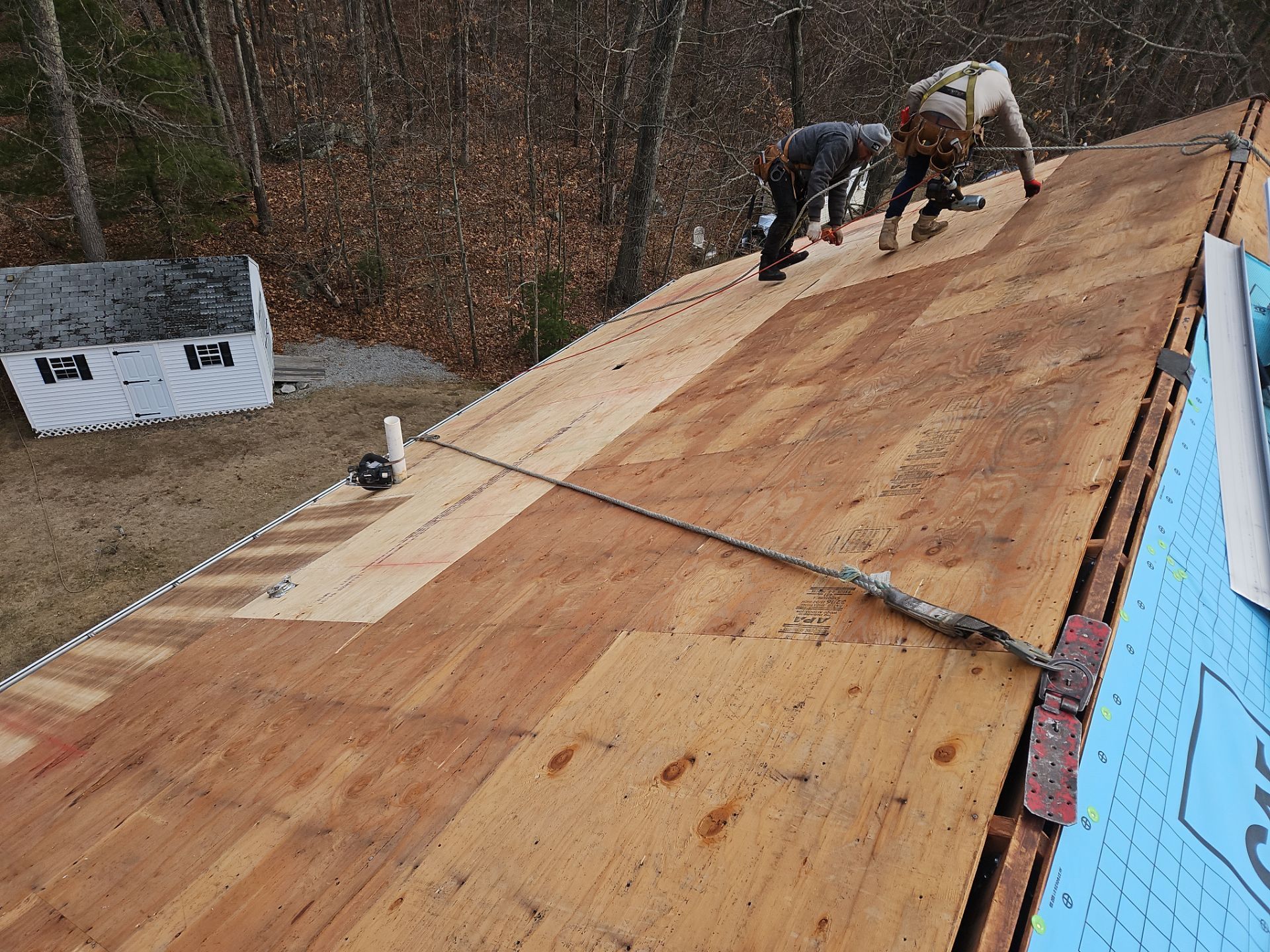 Bare roof decking with repairs.