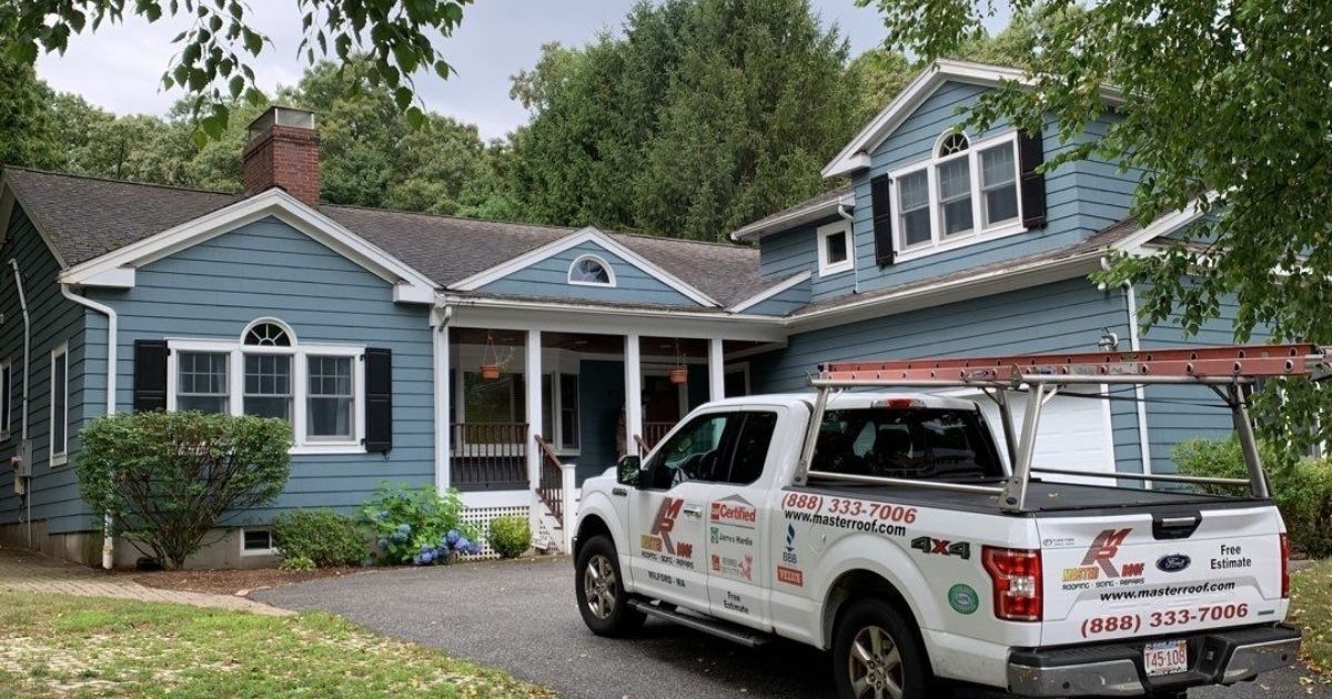 1958 Home with Master Roof truck in the driveway