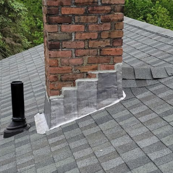 new shingles and chimney flashing