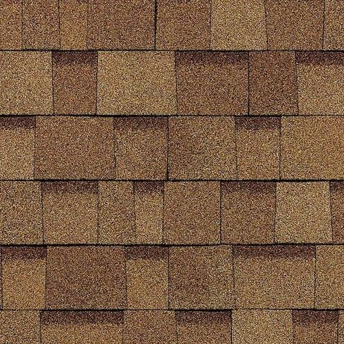 A close up of a roof with brown shingles.
