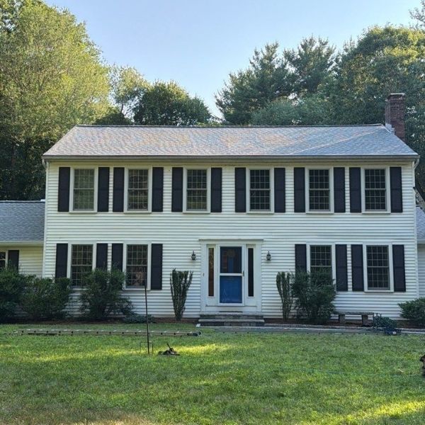 Yellow house with new roof