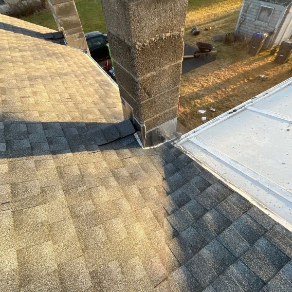 Newly flashed chimney and new roofing