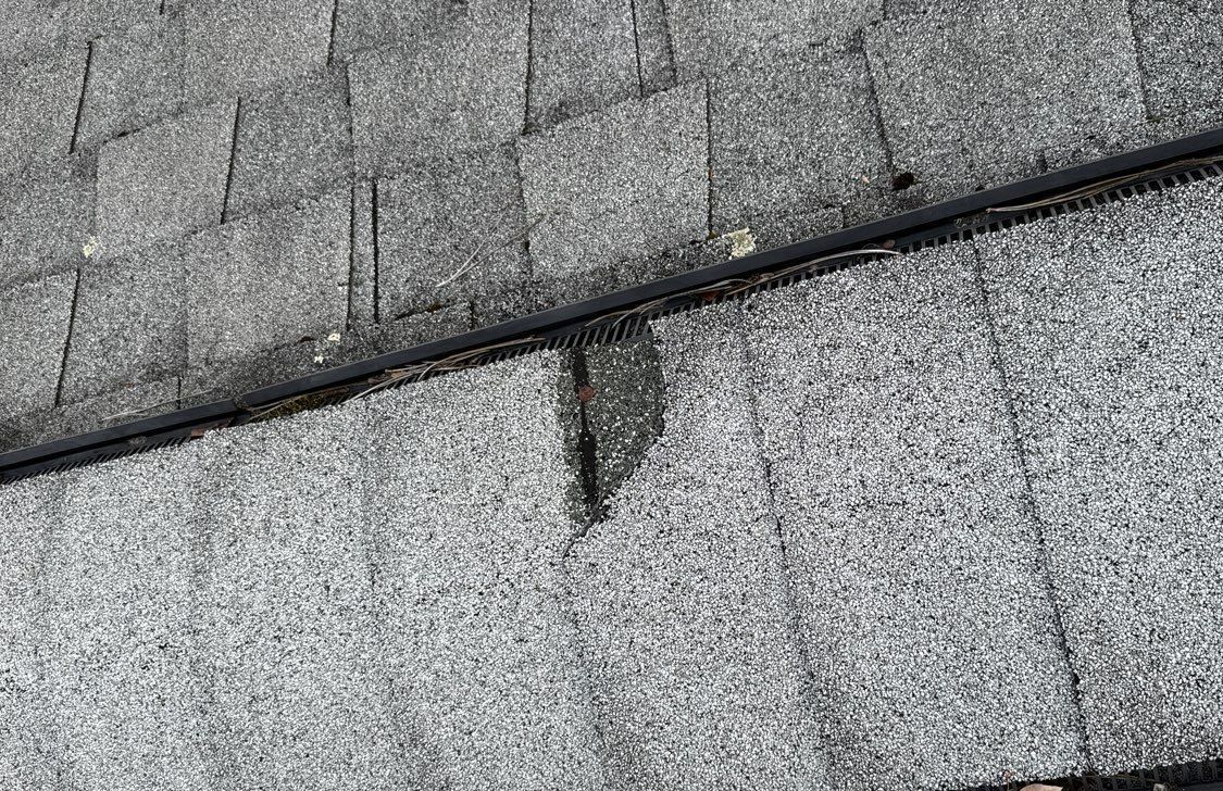 Ridge vent with broken shingle