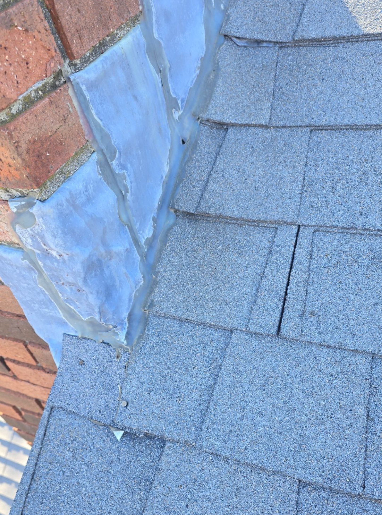 deteriorating chimney flashing and shingles