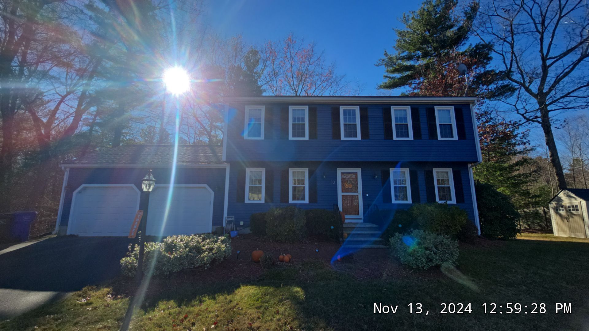 sun shining over a home in hopedale, ma