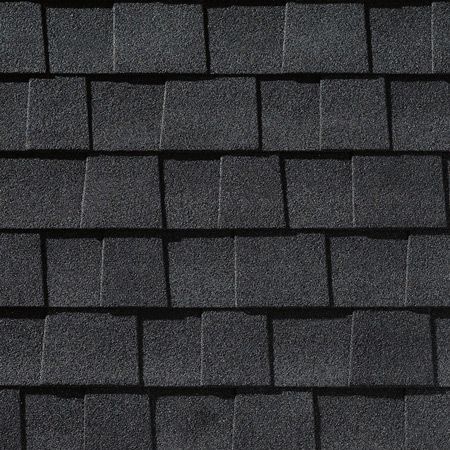 A close up of a black shingle roof.