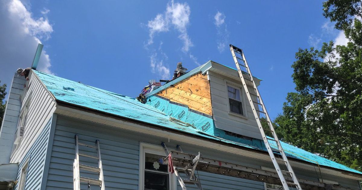 Master Roof team installing underlayment.