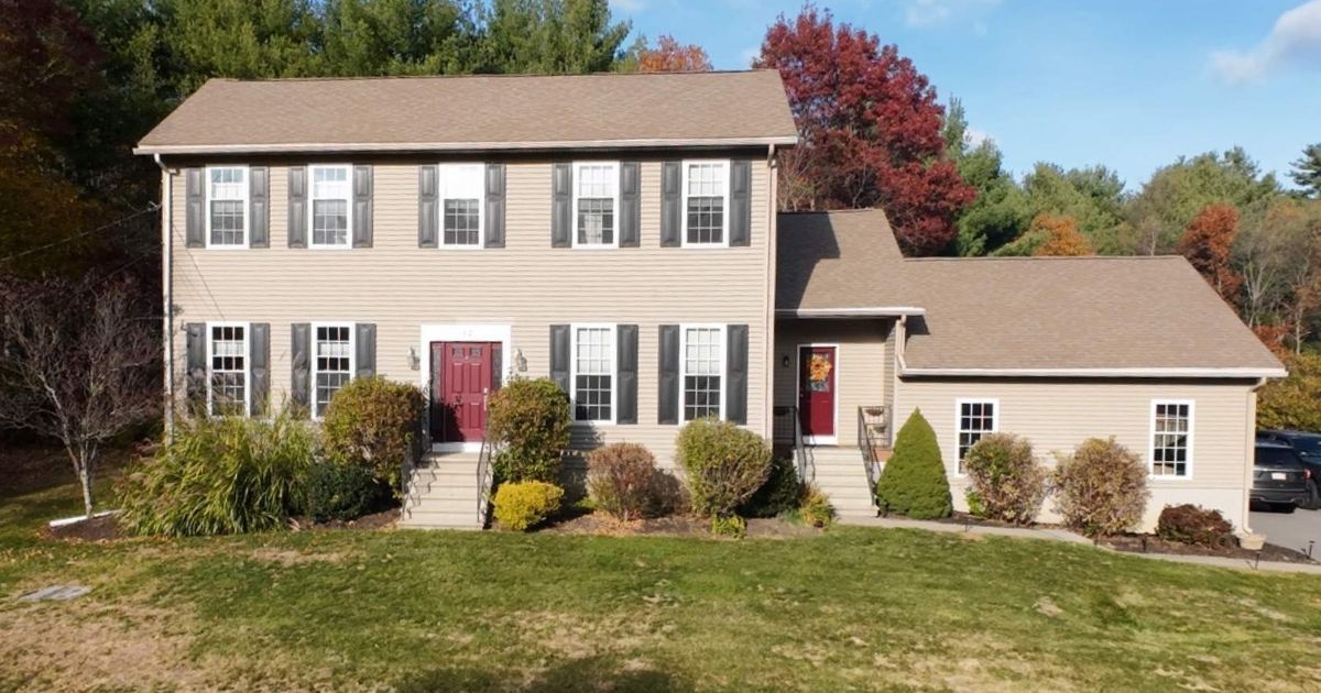 Colonial style home with old roofing.