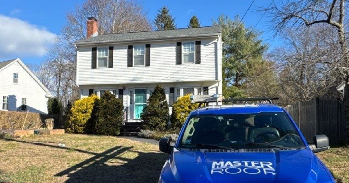 Home with Master Roof truck parked n the front.