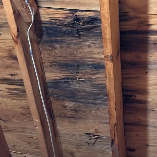 Roof sheathing stained by leaks
