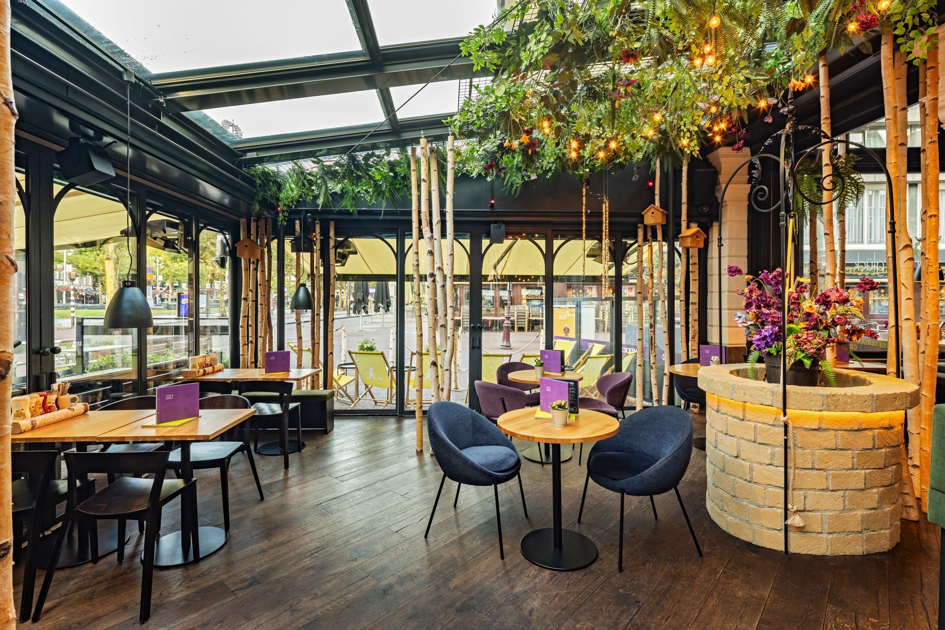 Erstes Hans im Glück Restaurant in Amsterdam, Niederlande - Moderne maßgeschneiderte Inneneinrichtung in gläsernem Wintergarten – Referenzprojekt Restaurantumbau Generalunternehmer Innenausbau