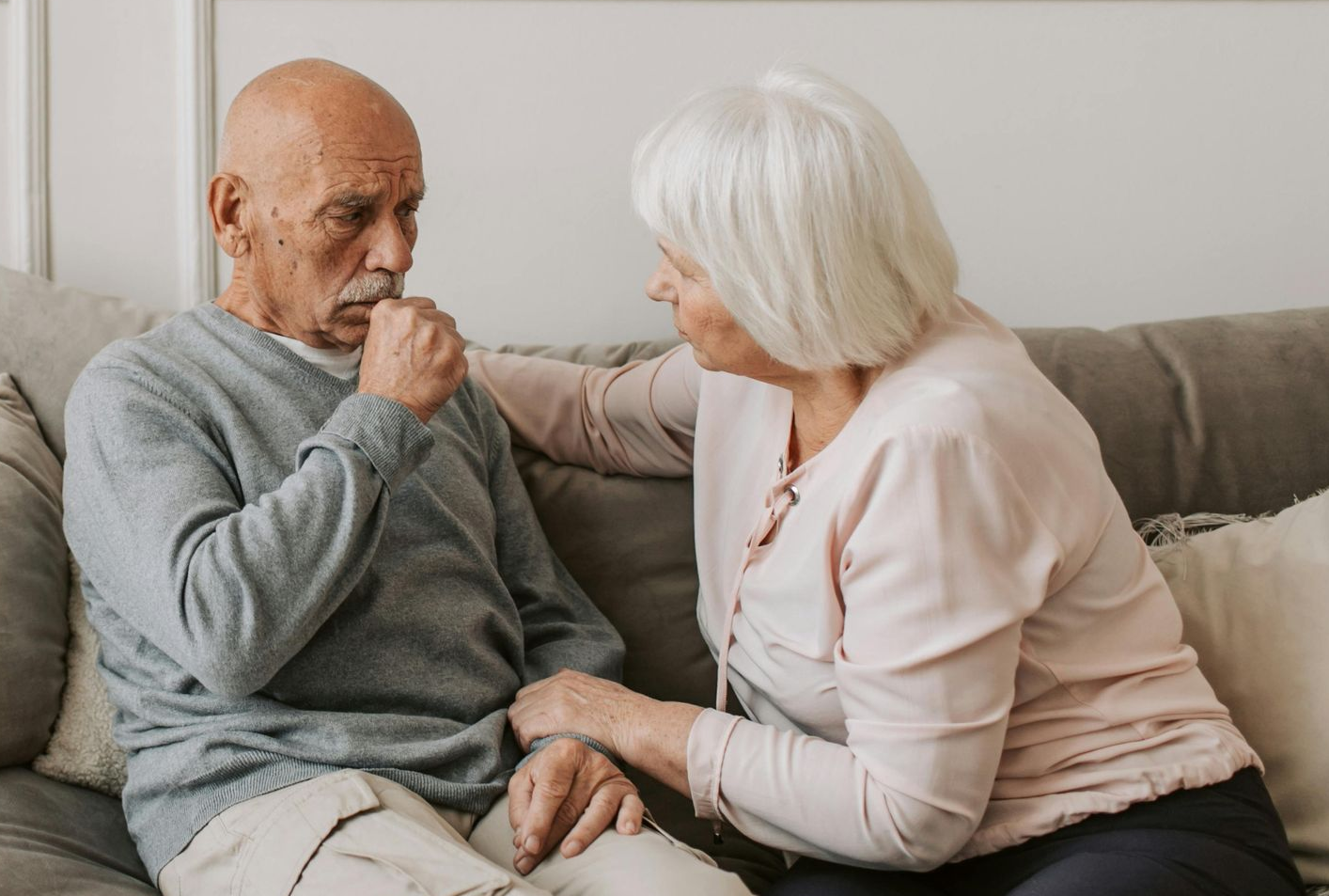 sick man being helped by his wife