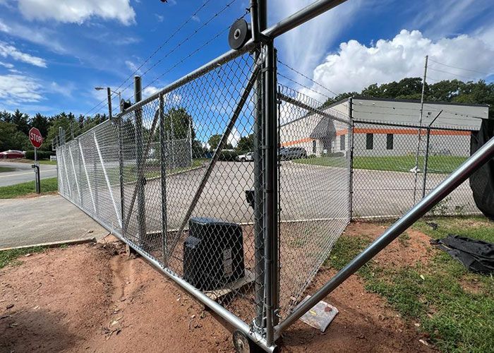 Chained Fence With A Barbed Wire - Thomasville, NC - SP Custom Fencing & Custom Buildings