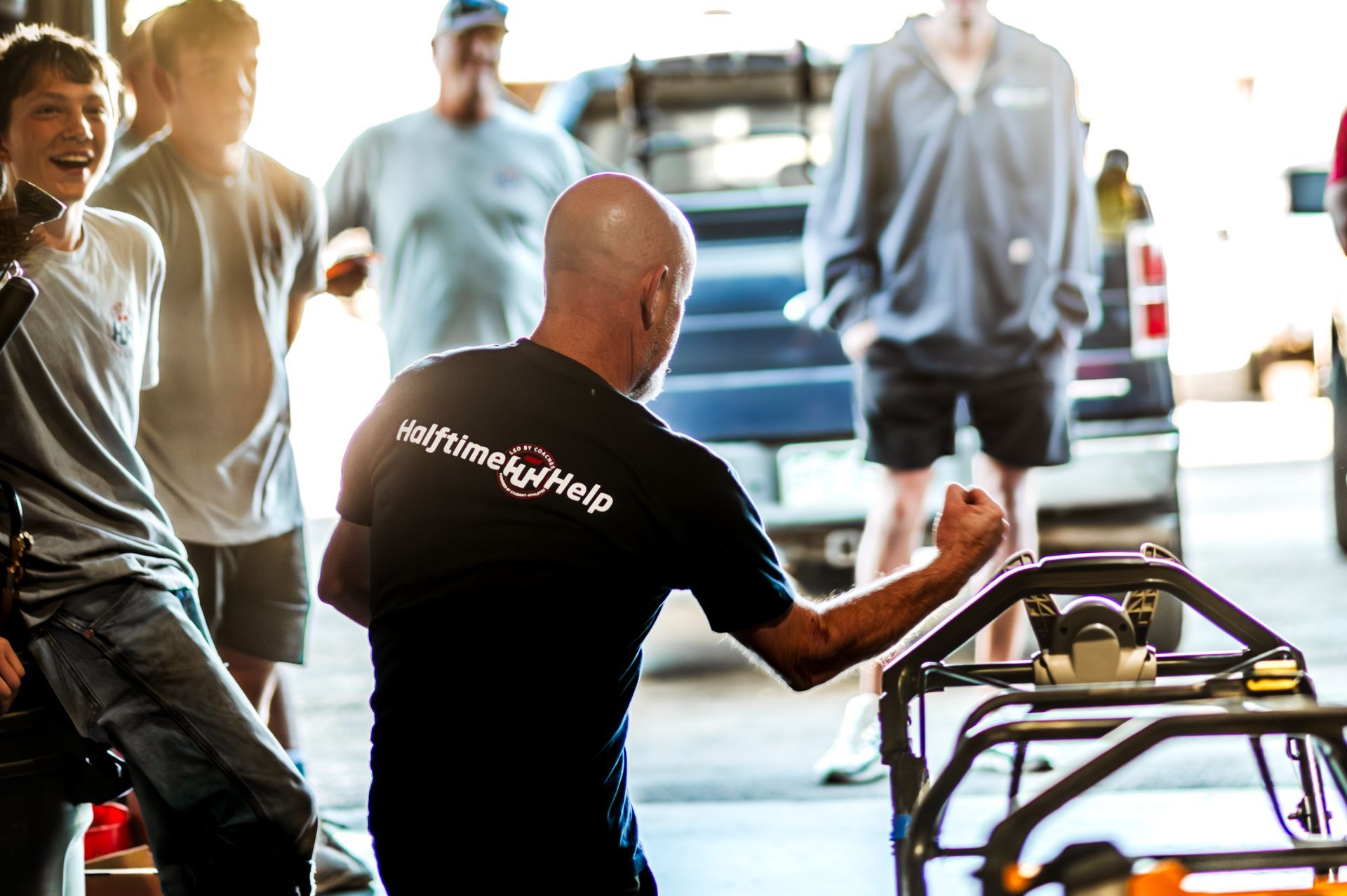 Halftime Help student-athlete preparing for a mowing day in south Denver metro