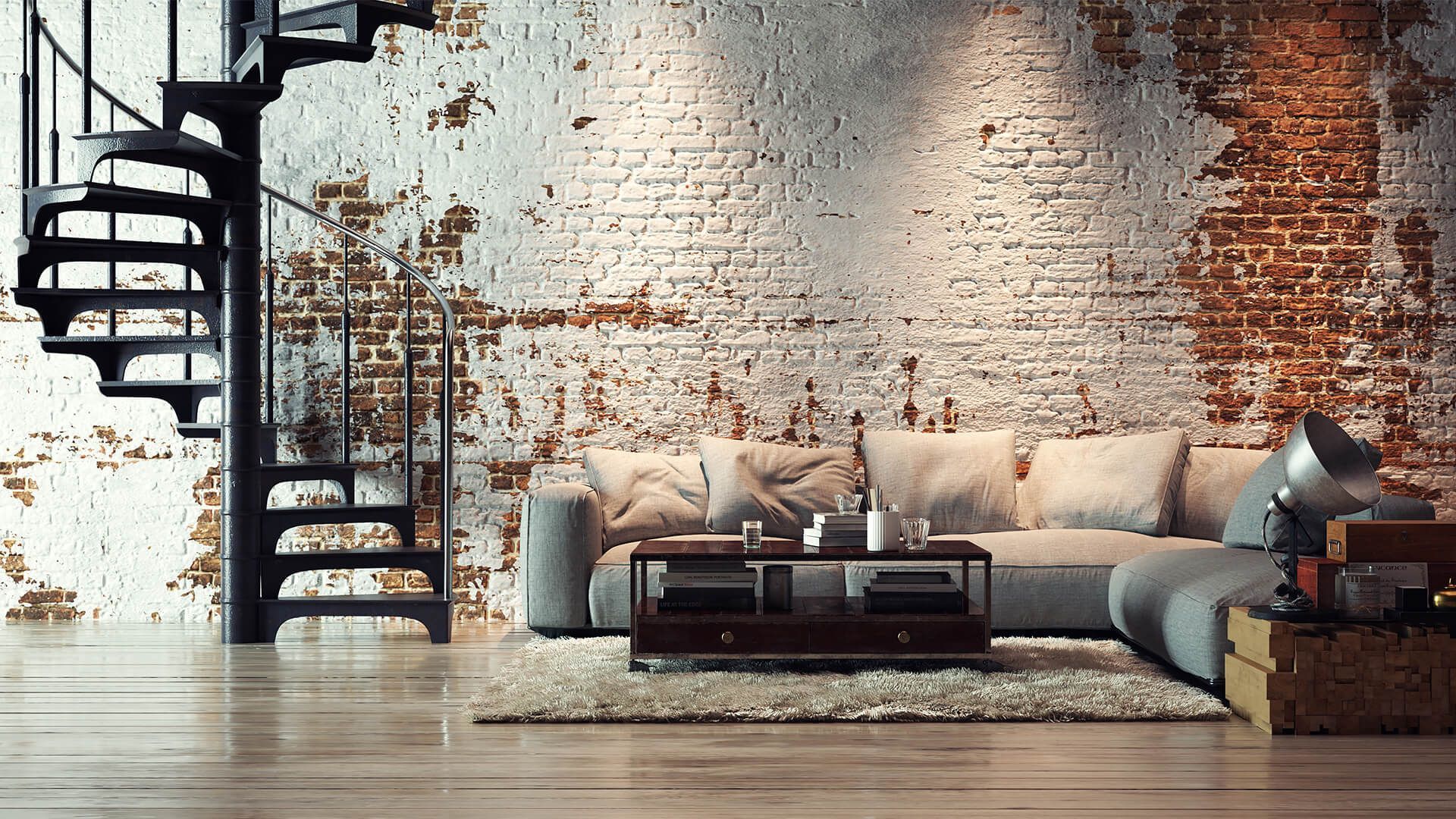 Un living cu o scară în spirală și un perete de cărămidă.