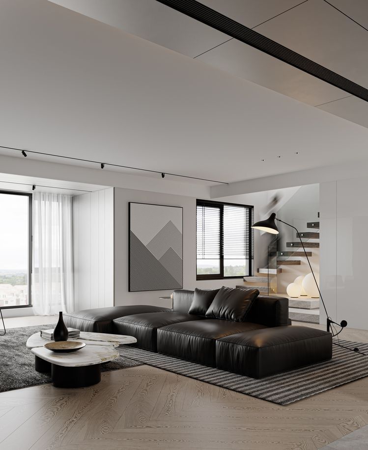 O cameră de zi cu o canapea , măsuță de cafea și scări.